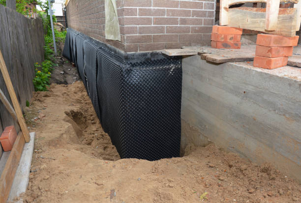 Happy homeowners after waterproofing job in Clawson
